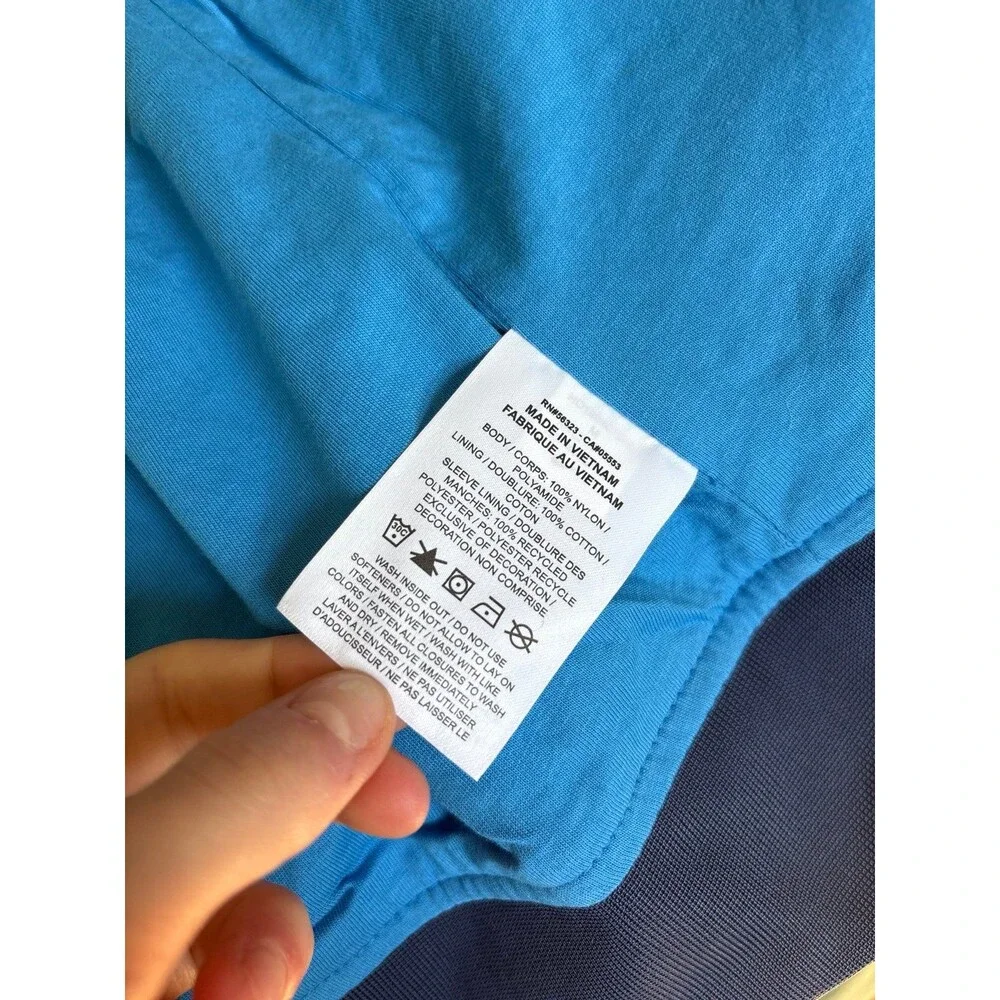 Women's Nike windbreaker rain jacket navy blue pockets Athletic sportswear NWOT